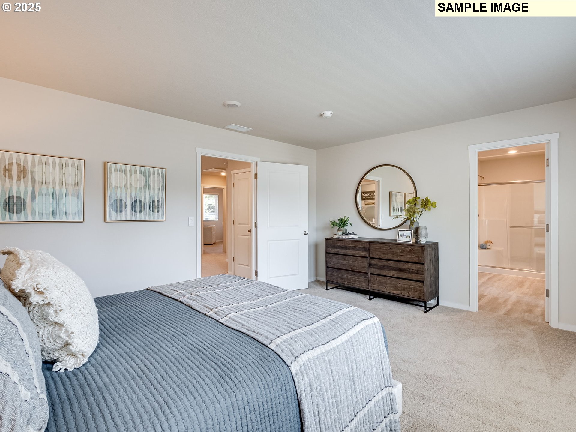 155 Northwest 30th Street Battle Ground, WA 98604 - Photo 27 of 36 a bedroom with a bed and a chandelier
