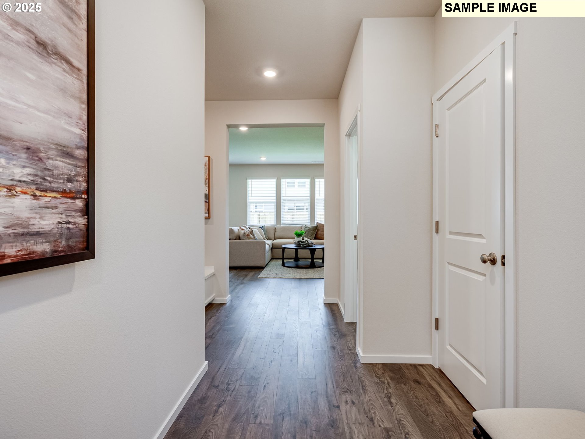 155 Northwest 30th Street Battle Ground, WA 98604 - Photo 3 of 36 a view of a hallway with wooden floor and a living room