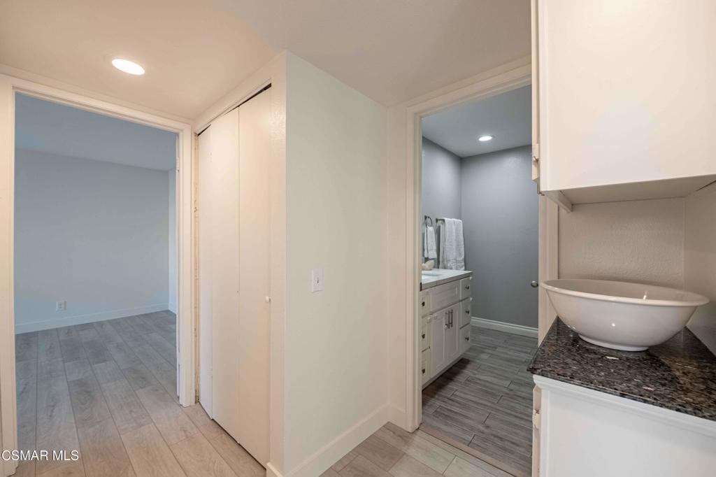 1718 Sinaloa Road, Unit 219 Simi Valley, CA 93065 - Photo 13 of 41 a bathroom with a granite countertop sink toilet and shower