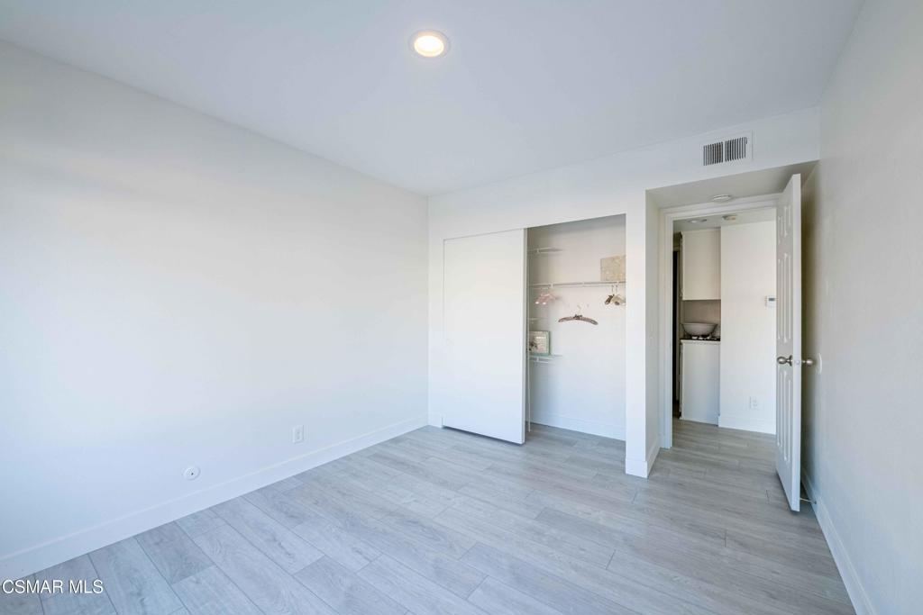 1718 Sinaloa Road, Unit 219 Simi Valley, CA 93065 - Photo 20 of 41 a view of an empty room and wooden floor