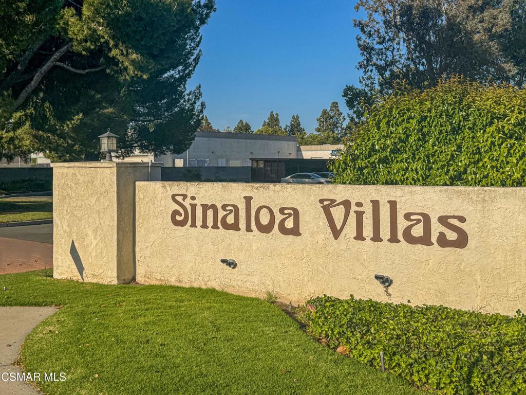 1718 Sinaloa Road, Unit 219 Simi Valley, CA 93065 - Photo 2 of 41 a sign broad in front of a white house