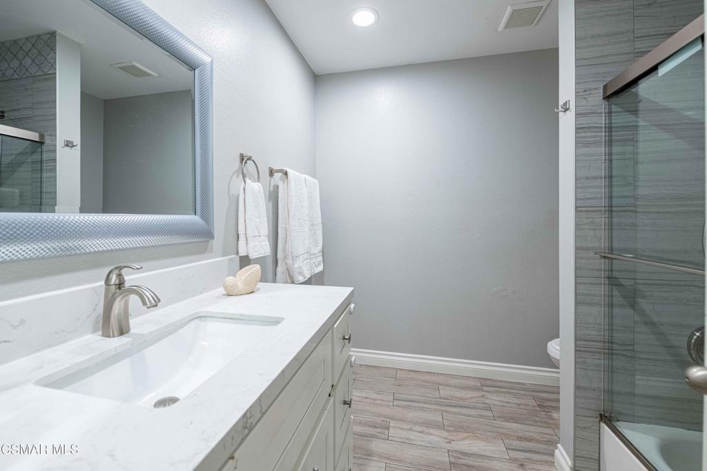 1718 Sinaloa Road, Unit 219 Simi Valley, CA 93065 - Photo 21 of 41 a bathroom with a sink and a mirror
