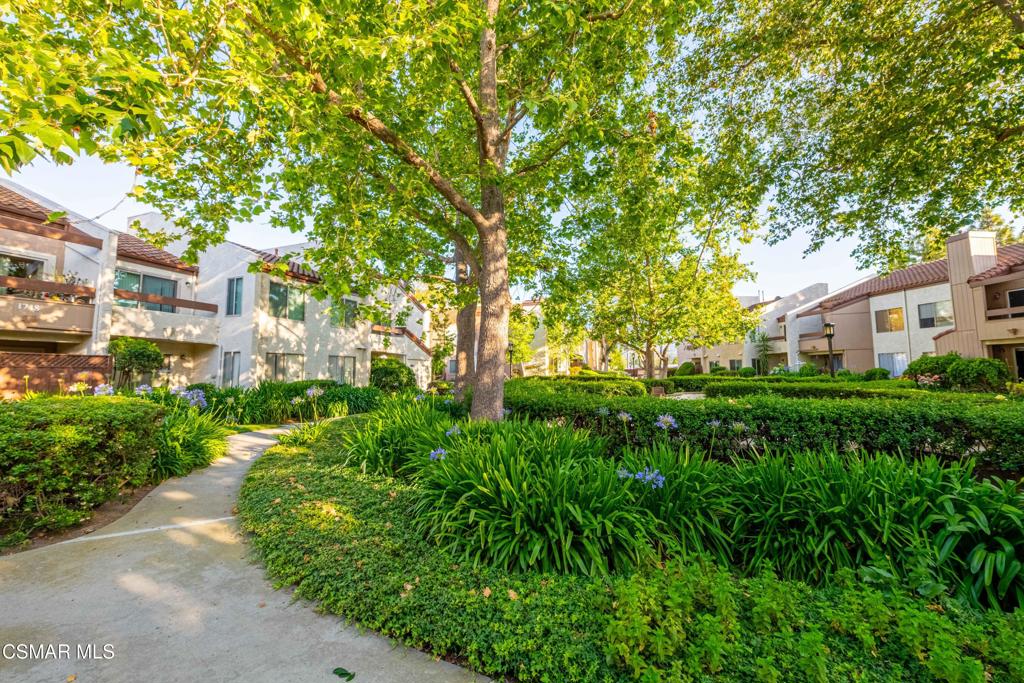 1718 Sinaloa Road, Unit 219 Simi Valley, CA 93065 - Photo 30 of 41 a front view of a house with a yard