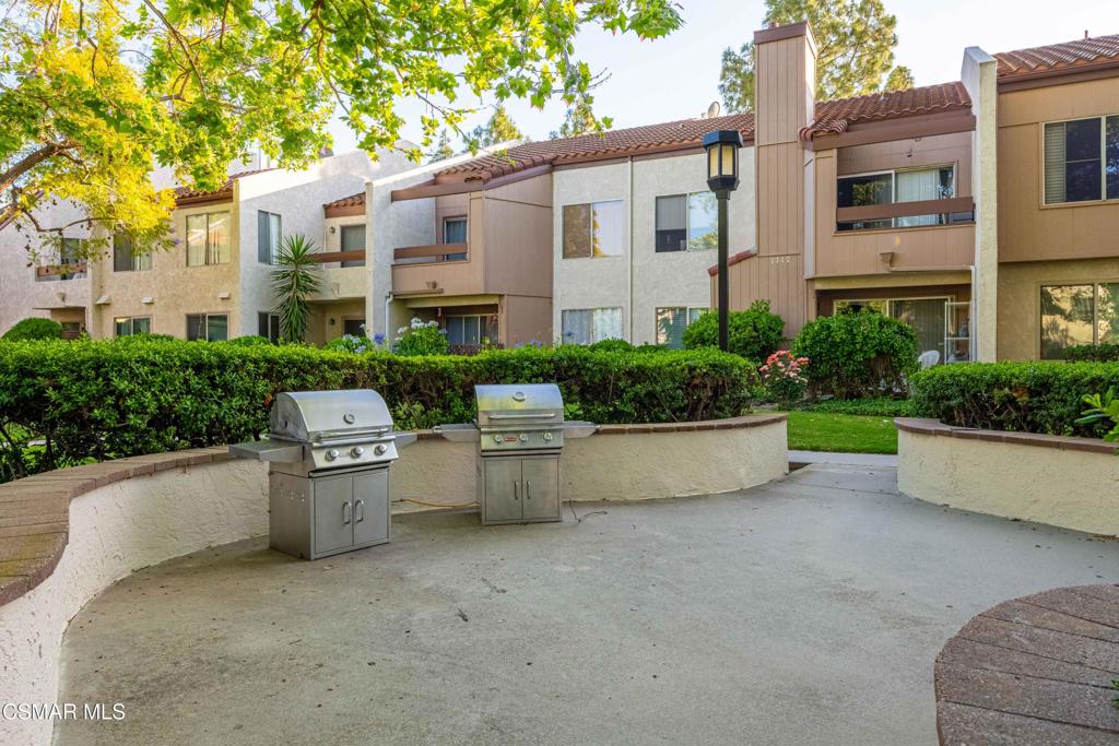 1718 Sinaloa Road, Unit 219 Simi Valley, CA 93065 - Photo 32 of 41 a view of a patio with couches and potted plants