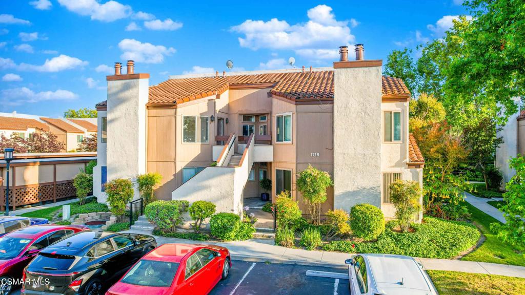 1718 Sinaloa Road, Unit 219 Simi Valley, CA 93065 - Photo 41 of 41 a front view of a house with a yard