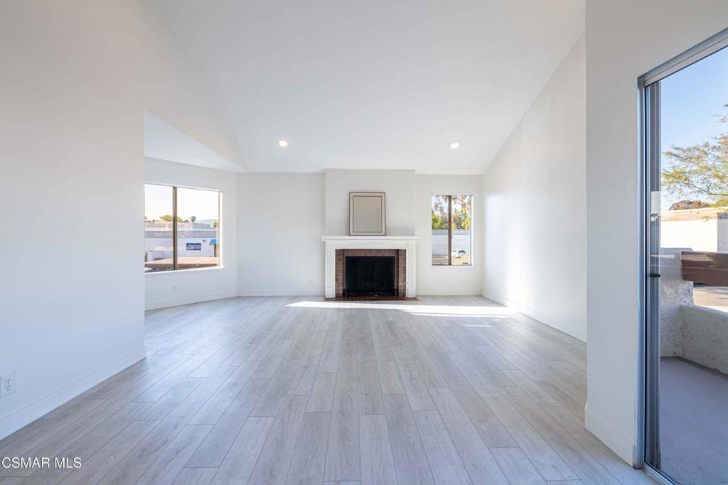1718 Sinaloa Road, Unit 219 Simi Valley, CA 93065 - Photo 6 of 41 wooden floor fireplace and windows in an empty room