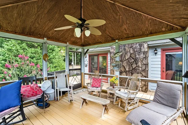 a living room with fireplace furniture and a chandelier