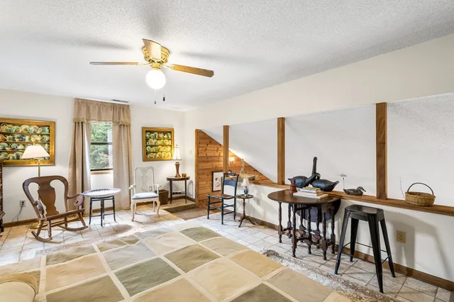 a bedroom with furniture and a wooden floor