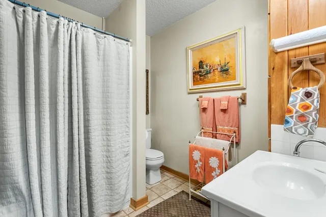 a view of a backyard with table and chairs