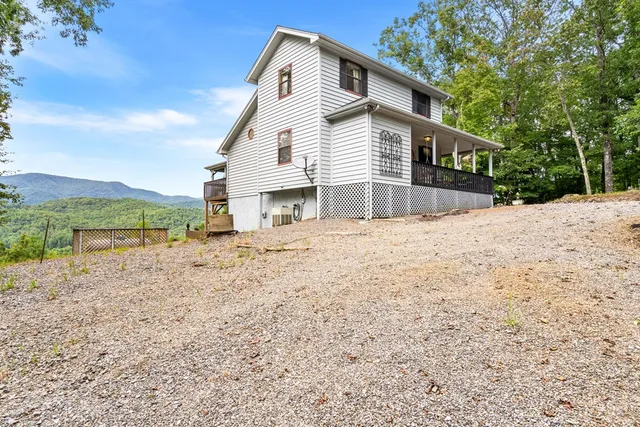 a view of a patio with a table and chairs