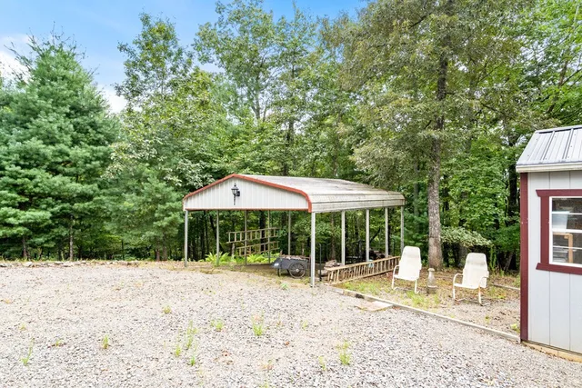 a view of balcony with couch and chairs