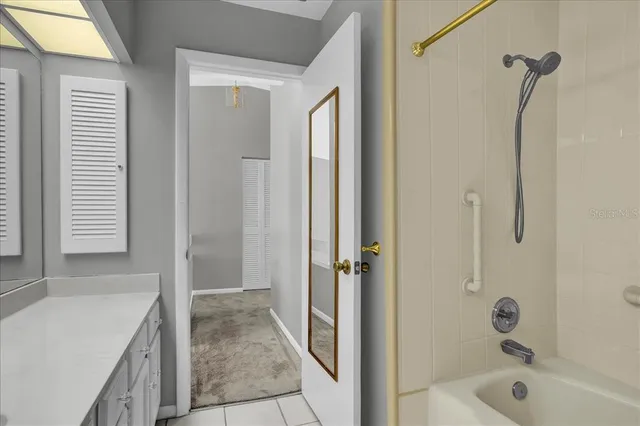 an aerial view of a house with a swimming pool