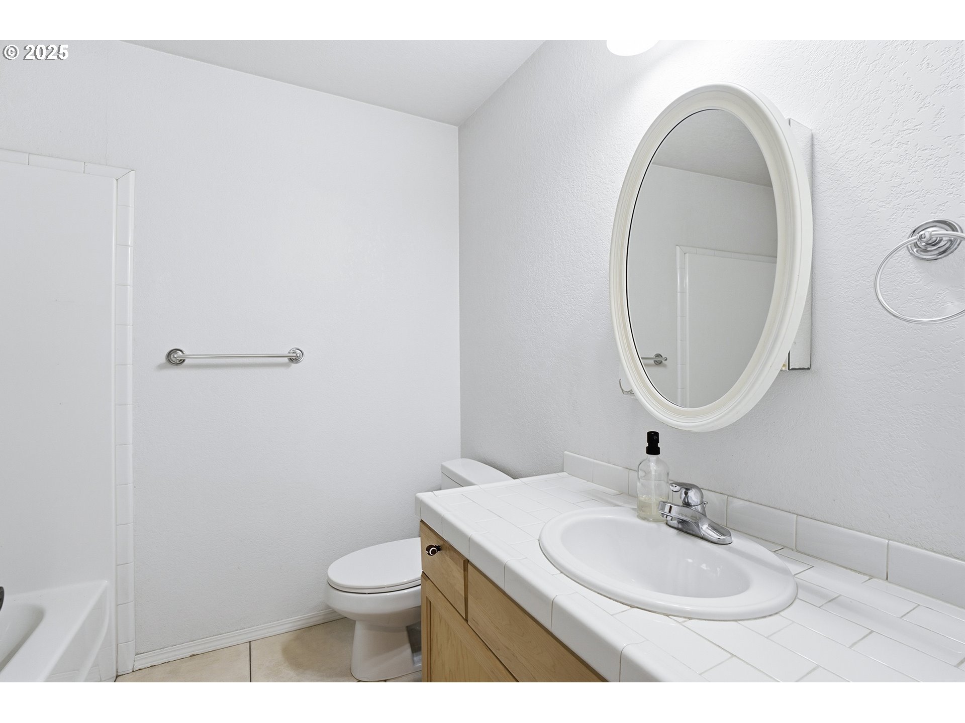 445 Harris Lane Oregon City, OR 97045 - Photo 25 of 29 a bathroom with a granite countertop toilet a sink and a mirror