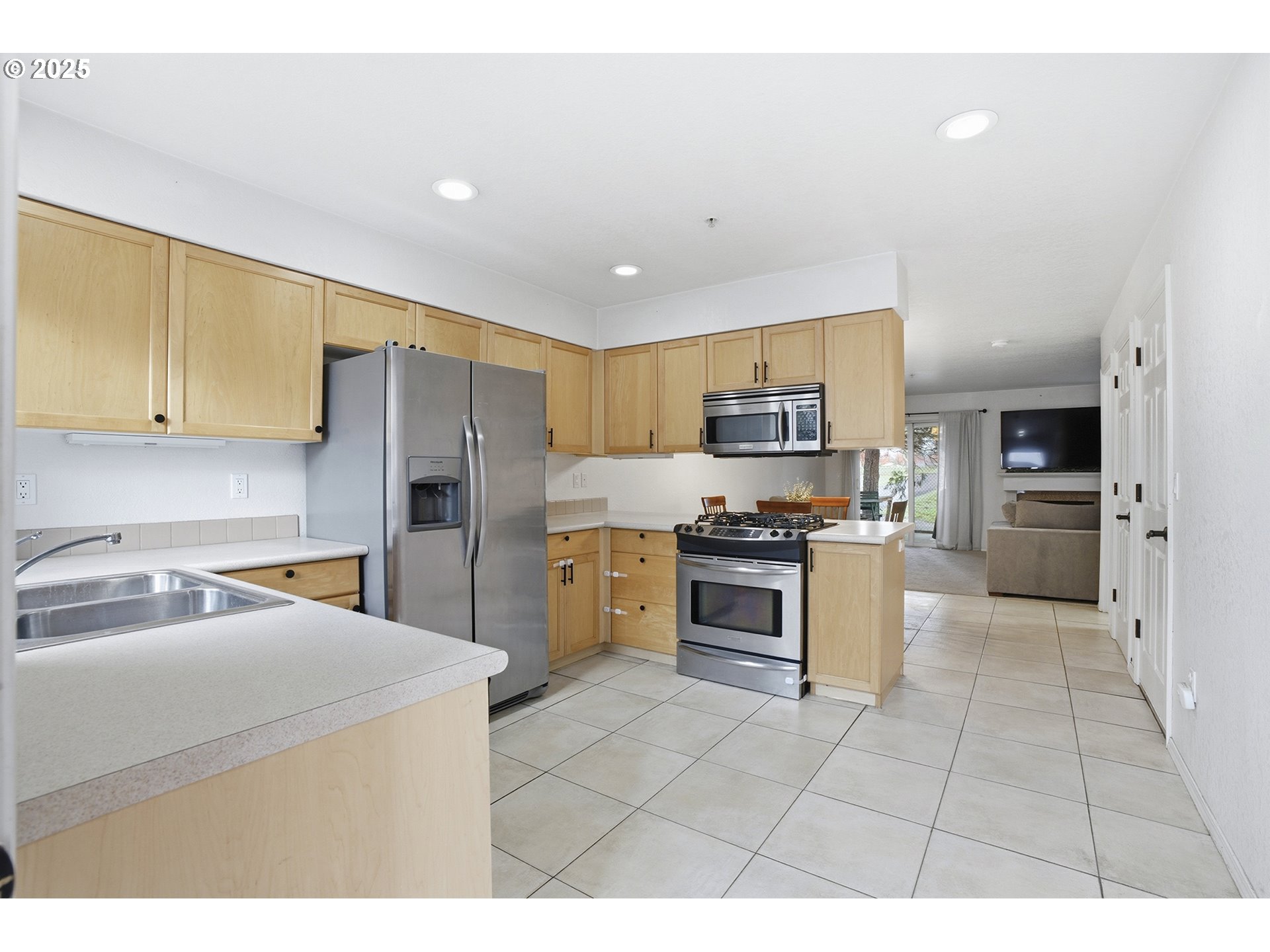 445 Harris Lane Oregon City, OR 97045 - Photo 3 of 29 a kitchen with granite countertop a sink a counter top space stainless steel appliances and cabinets