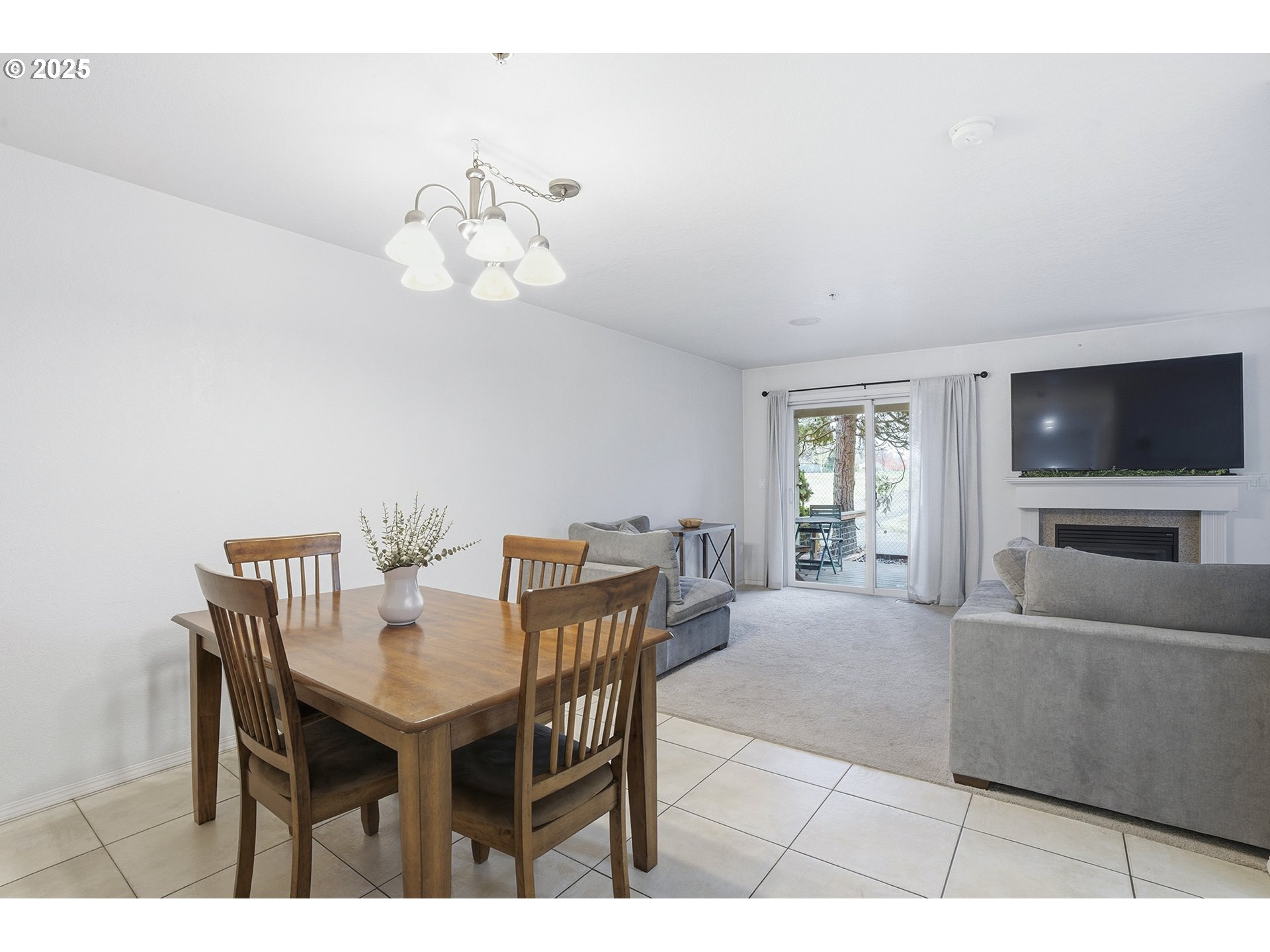 445 Harris Lane Oregon City, OR 97045 - Photo 6 of 29 a view of a livingroom with furniture and a flat screen tv