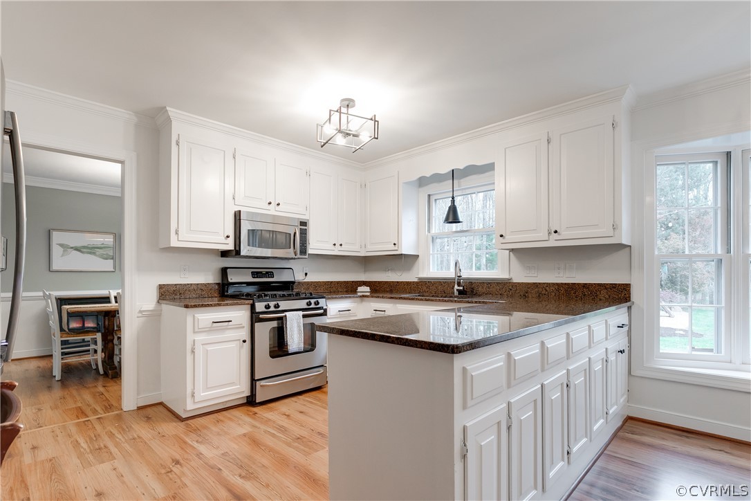 2910 East Brigstock Road Midlothian, VA 23113 - Photo 21 of 45 a kitchen with stainless steel appliances granite countertop a sink and cabinets
