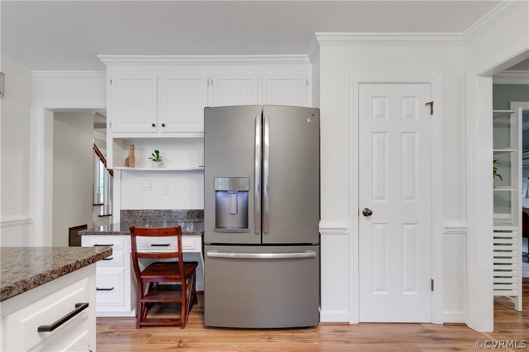2910 East Brigstock Road Midlothian, VA 23113 - Photo 23 of 45 a kitchen with stainless steel appliances a refrigerator and wooden cabinets