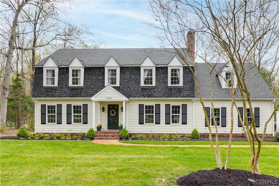 2910 East Brigstock Road Midlothian, VA 23113 - Photo 3 of 45 a front view of a house with a garden