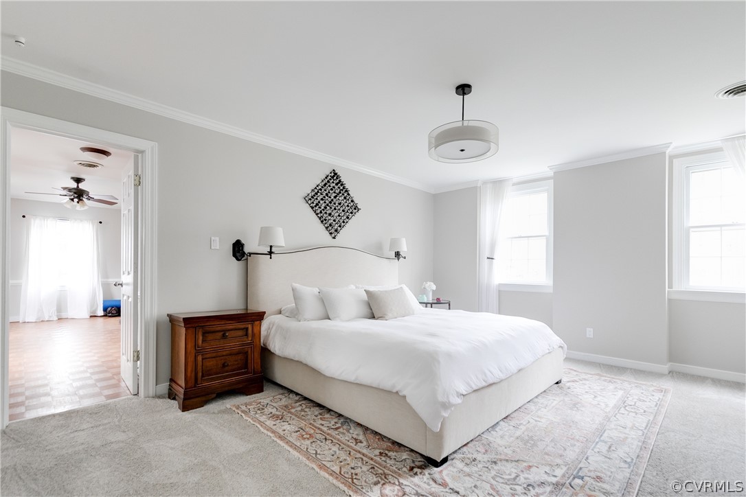2910 East Brigstock Road Midlothian, VA 23113 - Photo 39 of 45 a bedroom with a bed and a chandelier