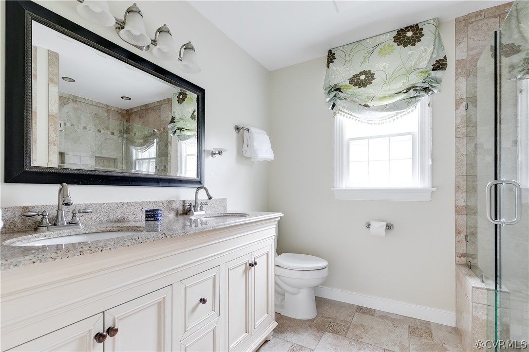 2910 East Brigstock Road Midlothian, VA 23113 - Photo 41 of 45 a bathroom with a toilet sink and mirror