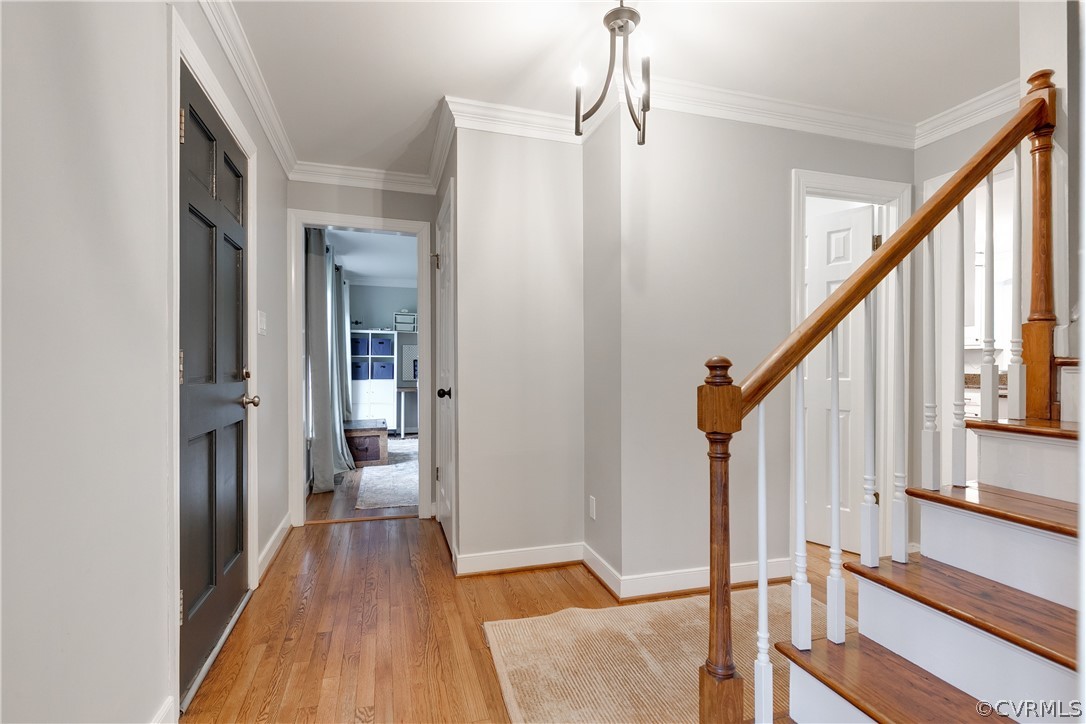 2910 East Brigstock Road Midlothian, VA 23113 - Photo 9 of 45 a view of a hallway with wooden floor and staircase