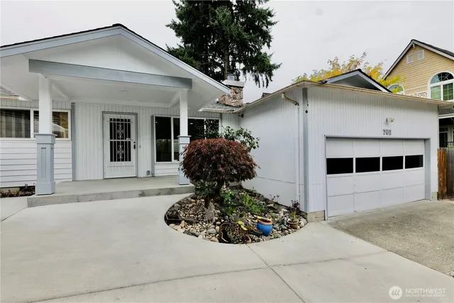 a front view of a house with garden