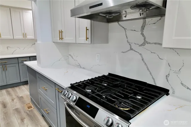 a close view of a stove top oven sitting inside of a kitchen