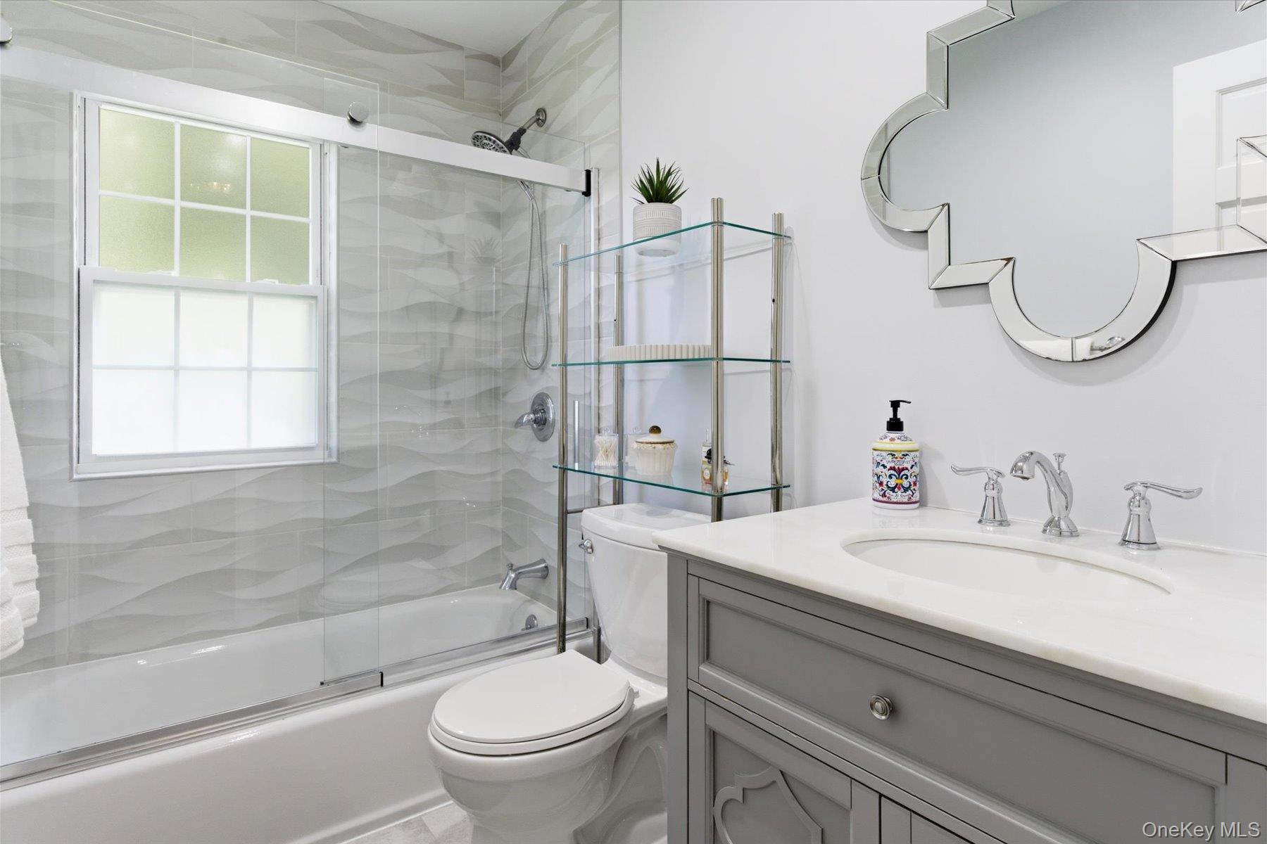 6 Brandy Road Cold Spring Harbor, NY 11724 - Photo 20 of 25 a bathroom with a sink a toilet and a mirror