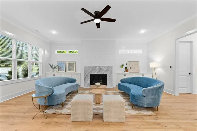 a living room with furniture and a fireplace