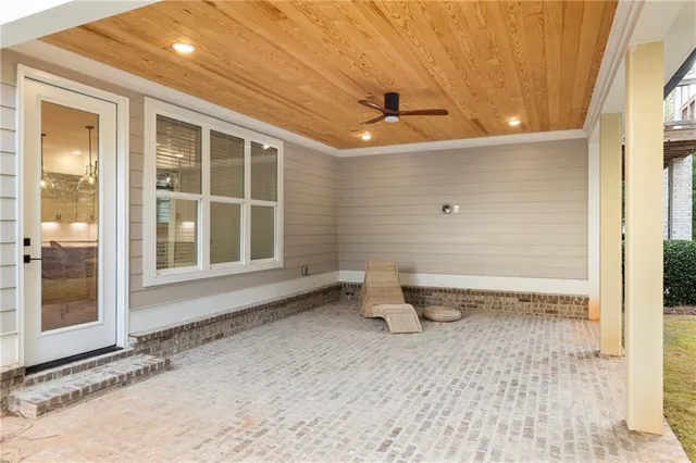 a bathroom with a toilet and a bathtub
