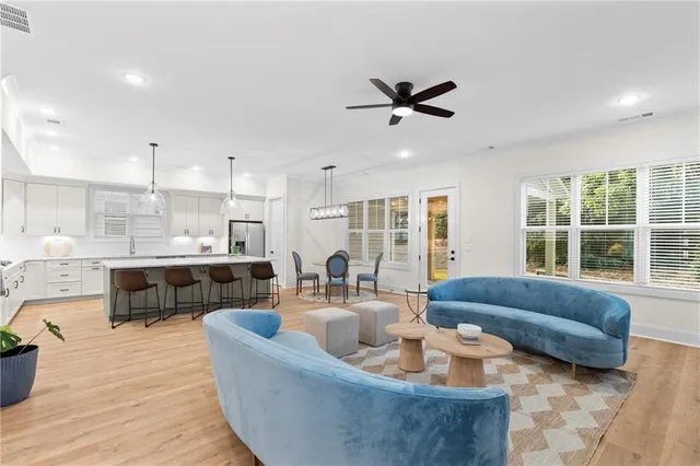 a living room with furniture and a large window