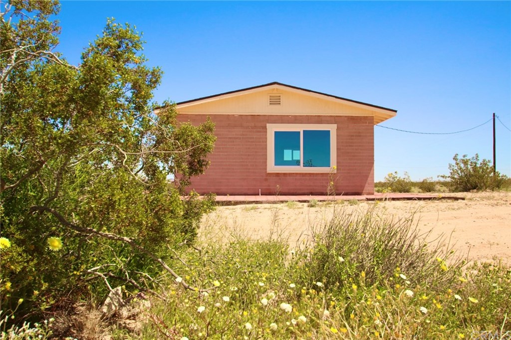 312 Cascade Road Joshua Tree, CA 92252 - Photo 1 of 1 a view of a house with a yard