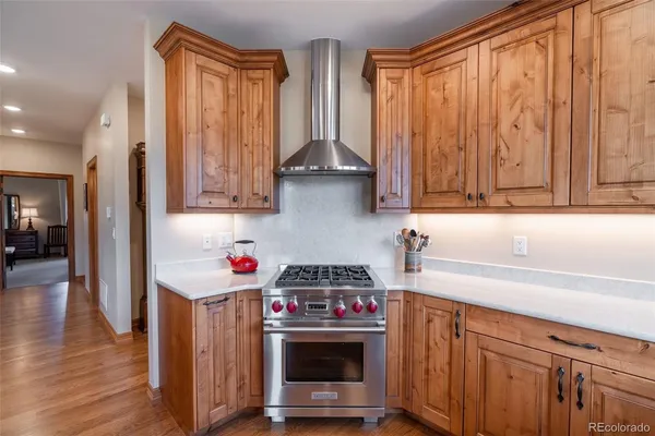 a kitchen with stainless steel appliances a stove and a refrigerator