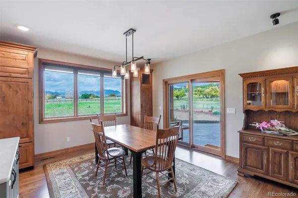 a dining room with furniture window wooden floor