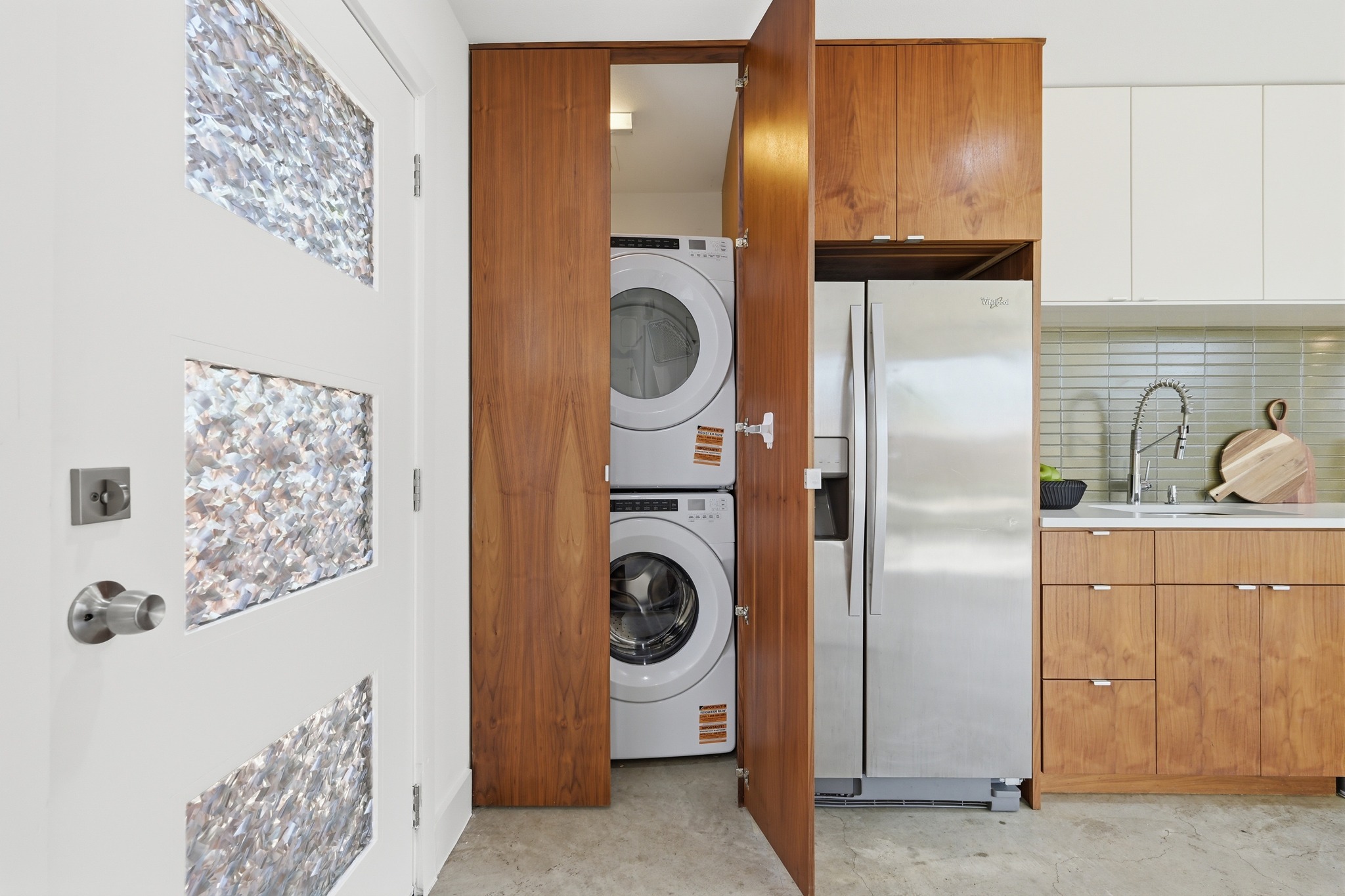 1805 Tillery Street Austin, TX 78721 - Photo 17 of 23 Laundry area featuring stacked washer / drying machine and concrete floors
