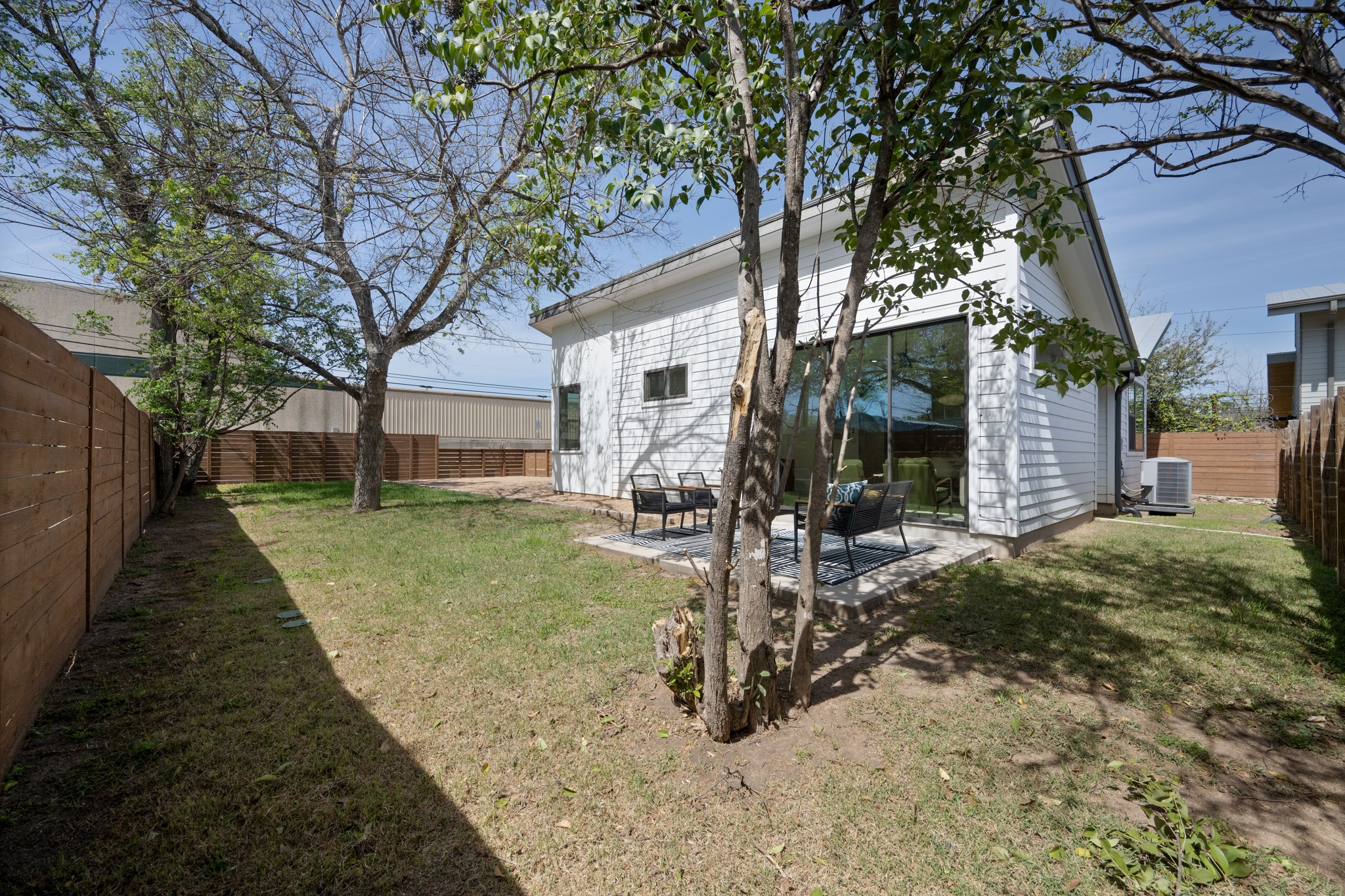1805 Tillery Street Austin, TX 78721 - Photo 21 of 23 Rear view of property with a fenced backyard and a patio area