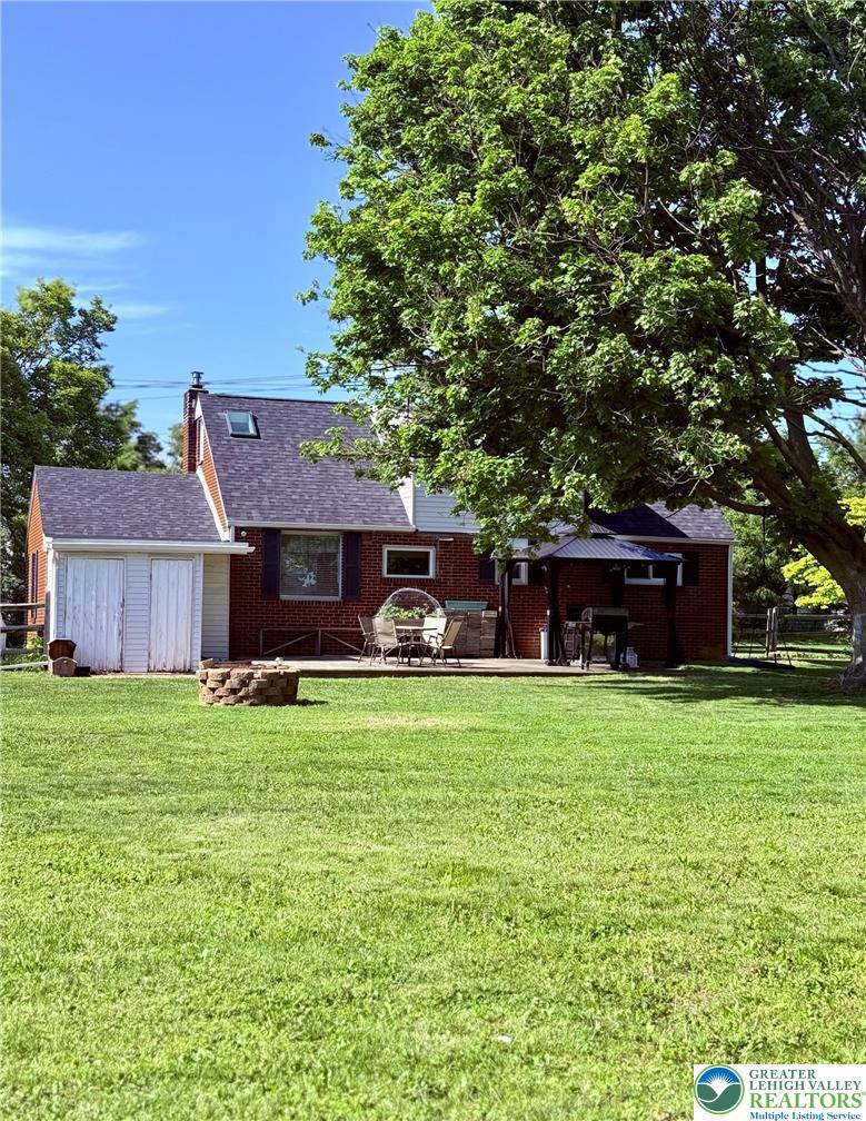 1275 Macada Road Bethlehem, PA 18017 - Photo 84 of 87 A spacious lawn provides ample outdoor entertaining space behind this charming brick home.