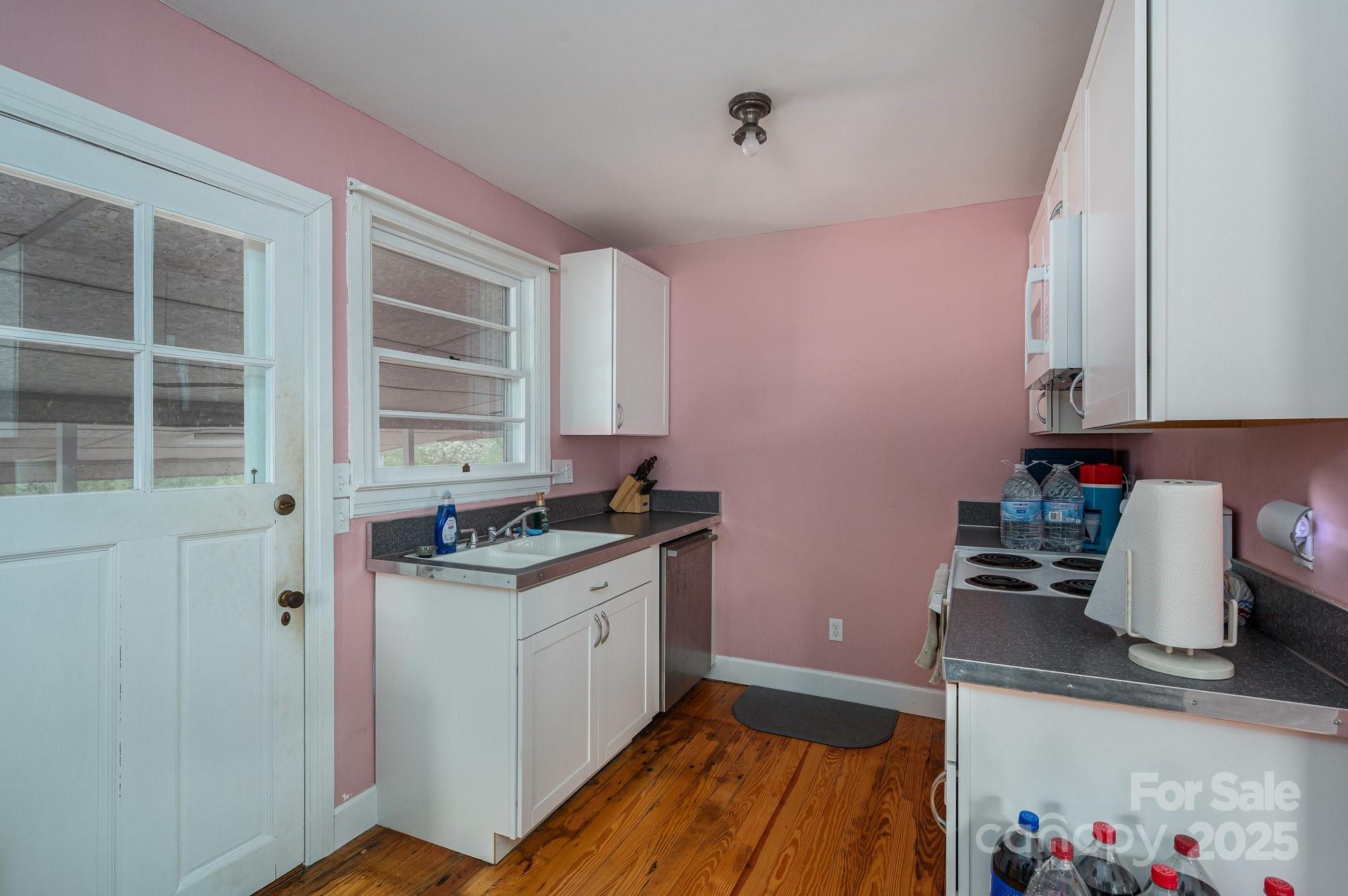 400 North Houser Street Cherryville, NC 28021 - Photo 11 of 26 a kitchen with stainless steel appliances granite countertop a stove and a sink