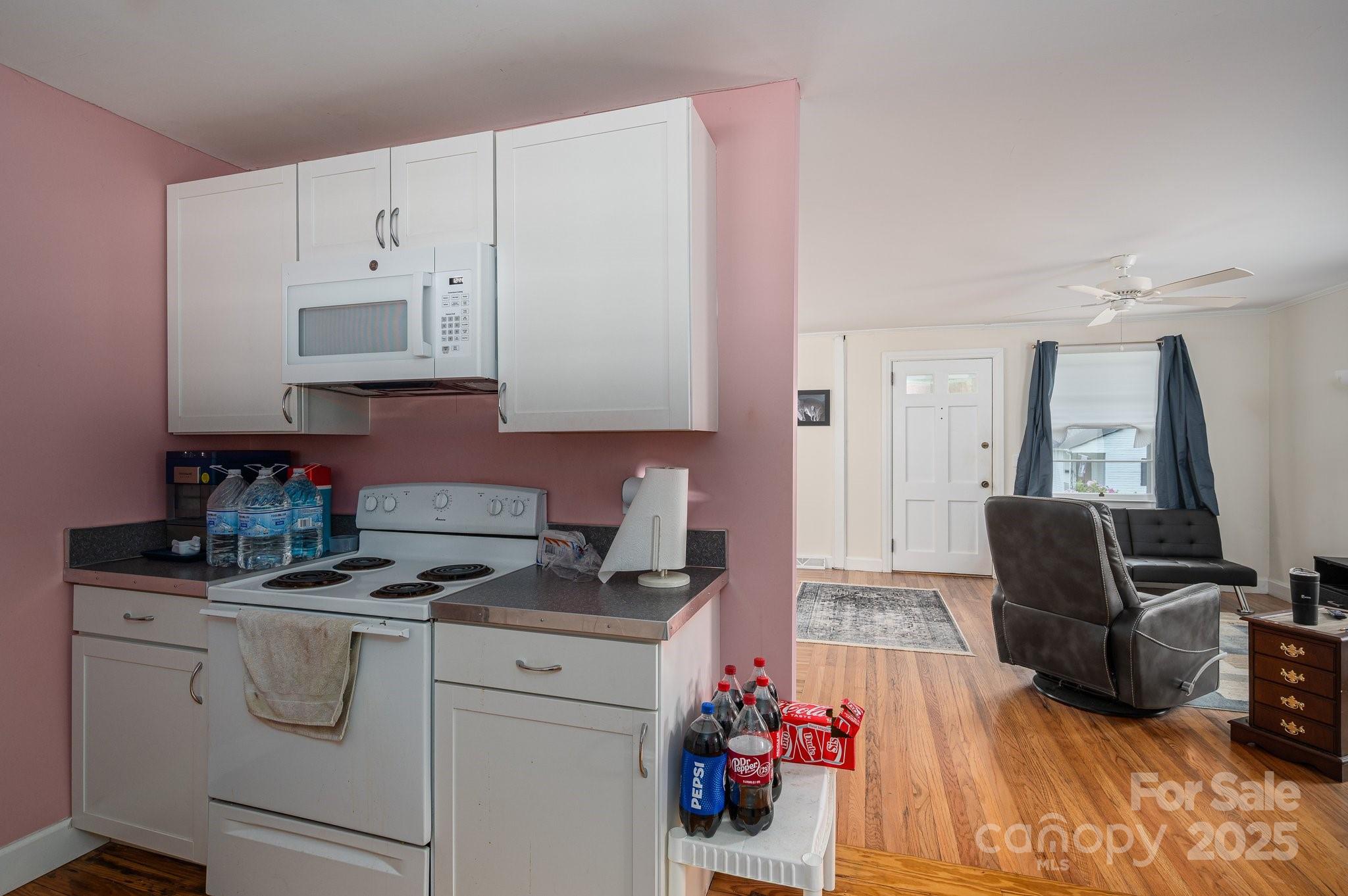 400 North Houser Street Cherryville, NC 28021 - Photo 12 of 26 a view of kitchen with furniture and wooden floor