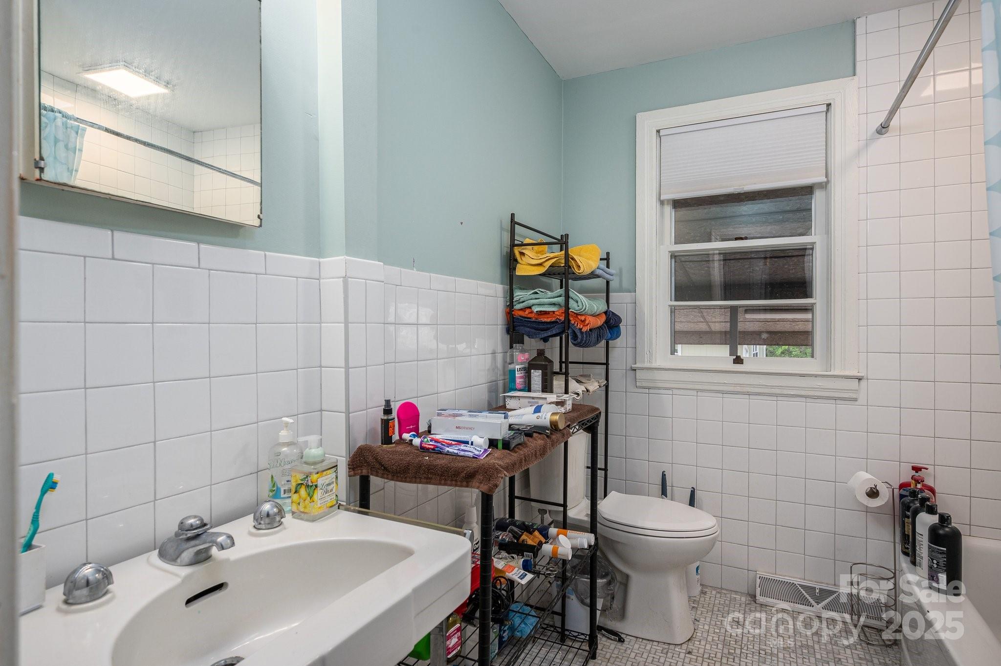 400 North Houser Street Cherryville, NC 28021 - Photo 15 of 26 a bathroom with a sink and a toilet