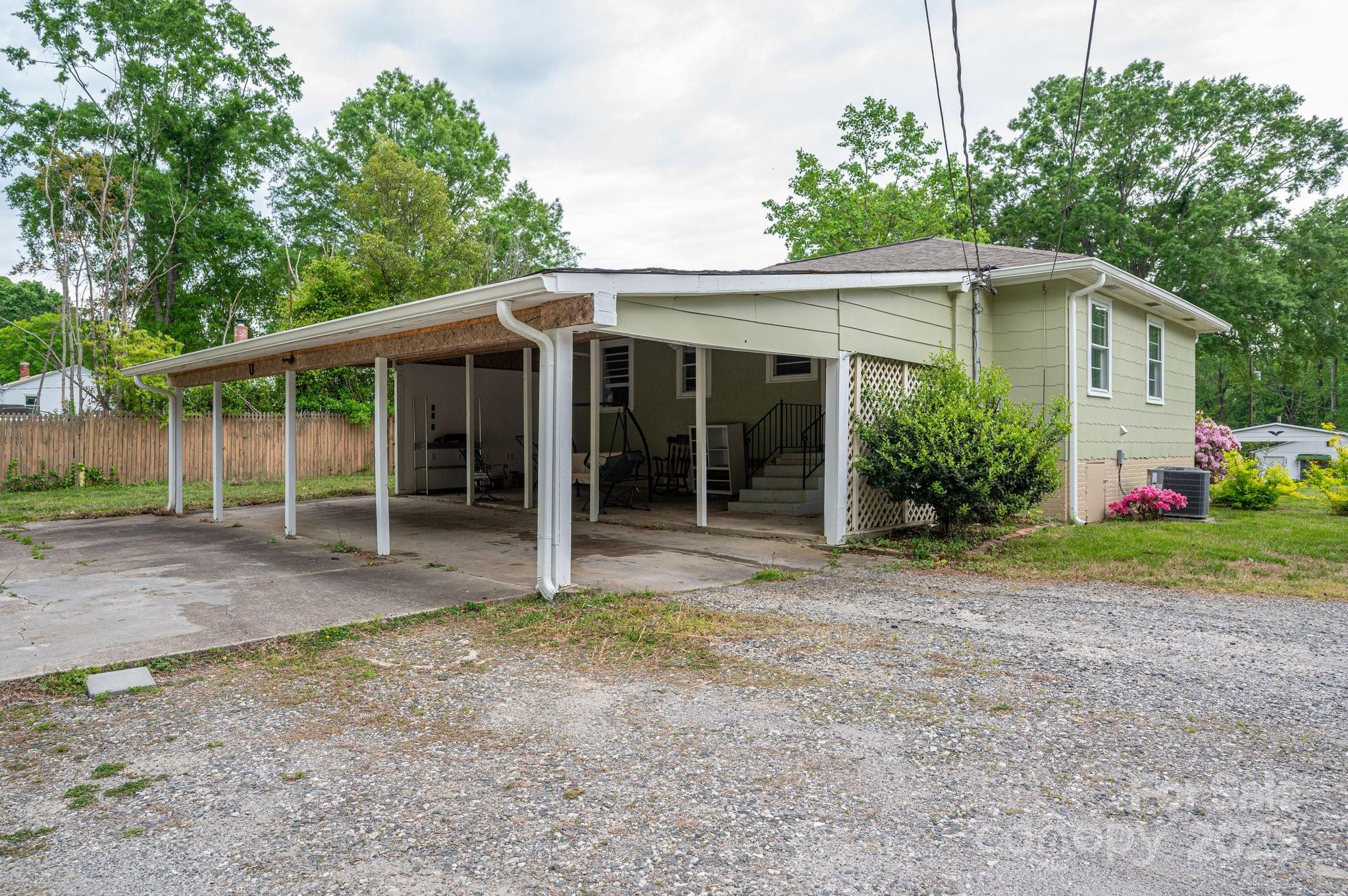 400 North Houser Street Cherryville, NC 28021 - Photo 21 of 26 a view of a house with backyard and garden
