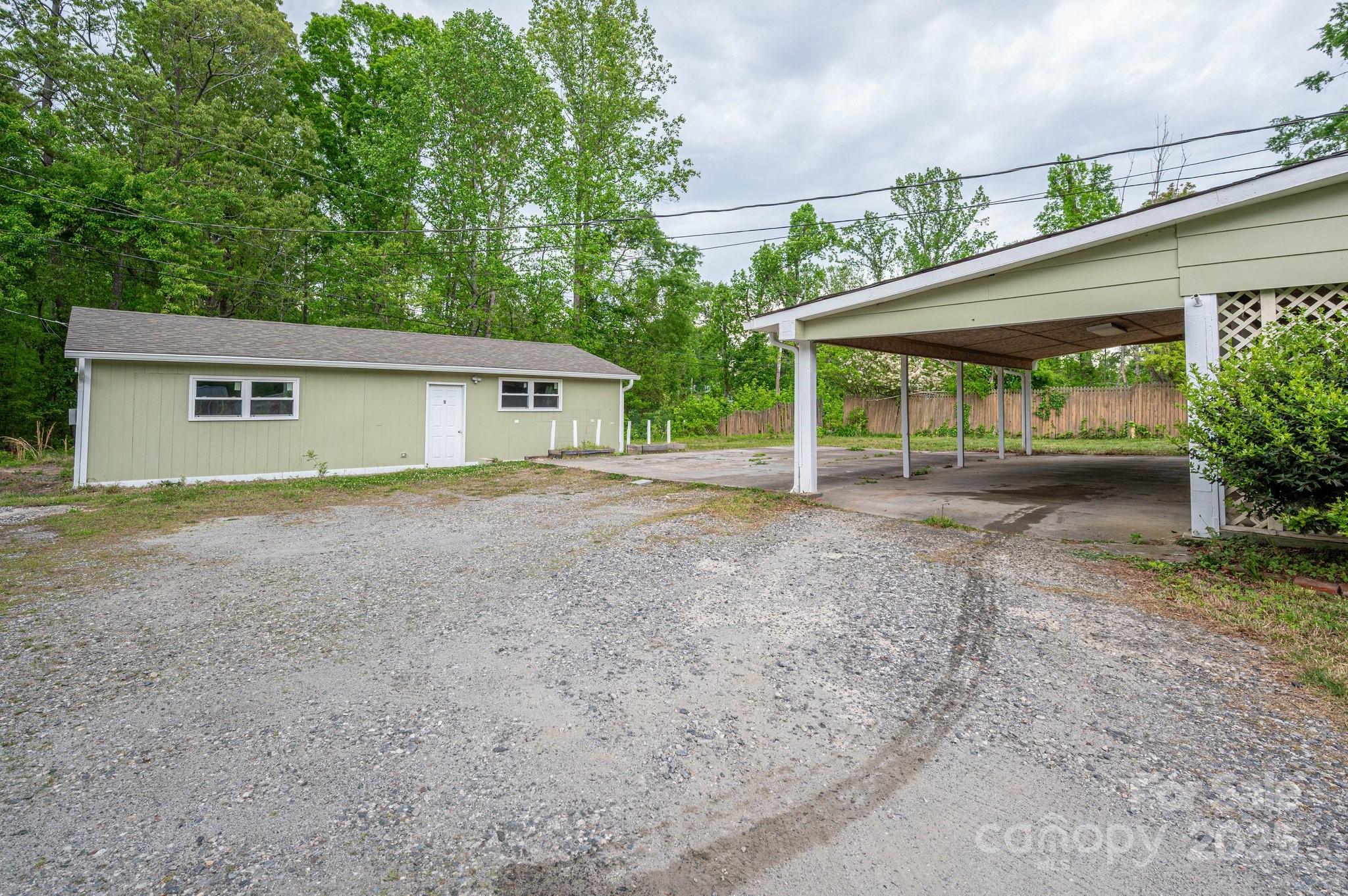 400 North Houser Street Cherryville, NC 28021 - Photo 22 of 26 a view of a house with a backyard and floor
