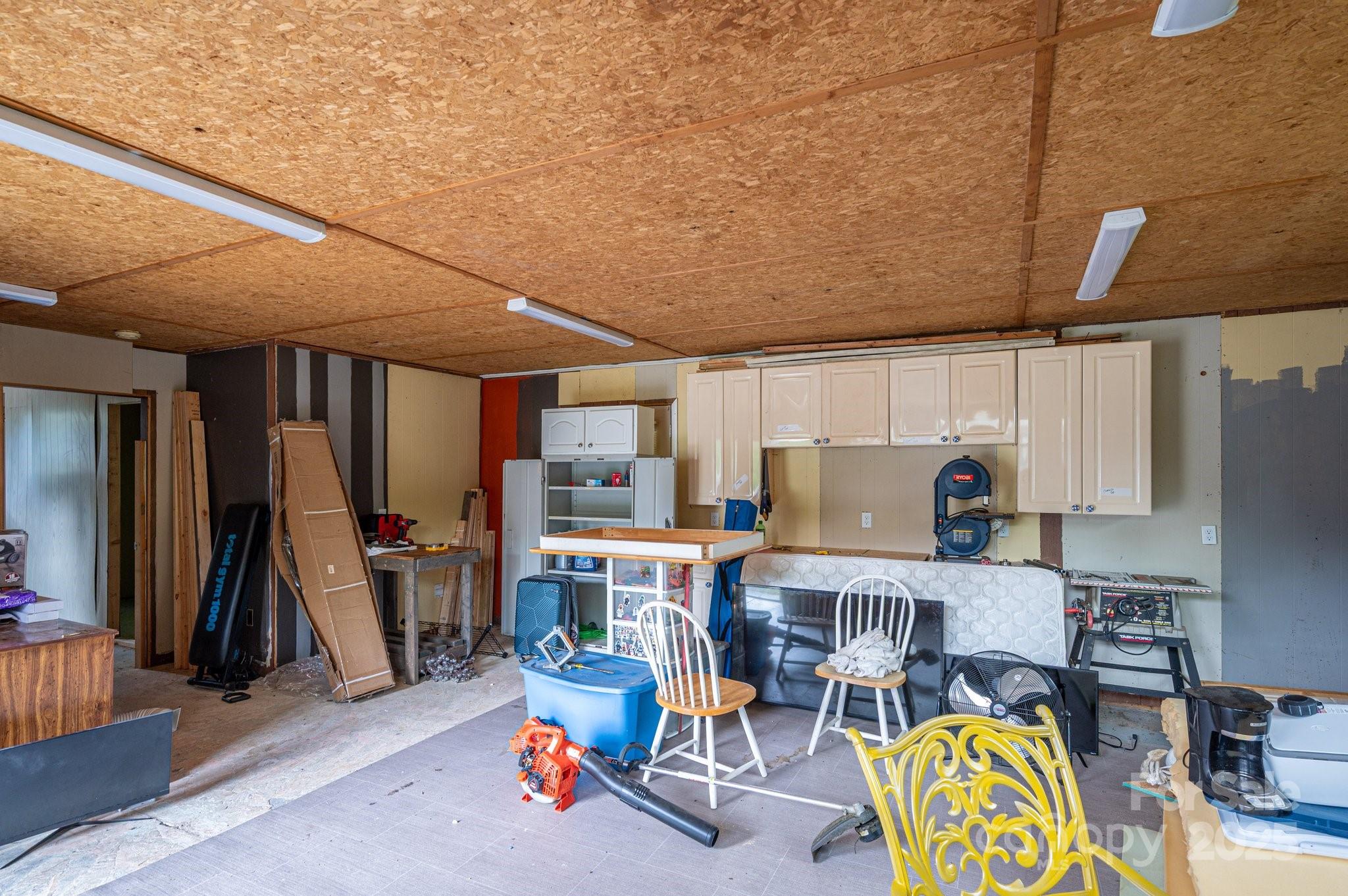 400 North Houser Street Cherryville, NC 28021 - Photo 23 of 26 a living room with a couch and a dining table with chairs