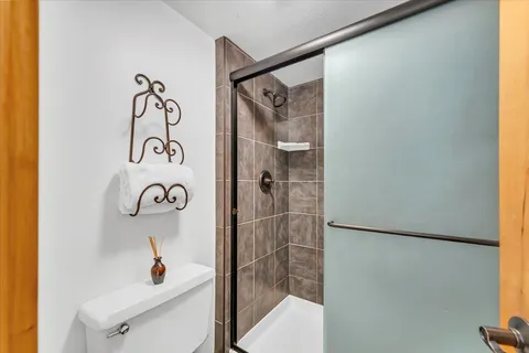 a bathroom with a shower and a sink