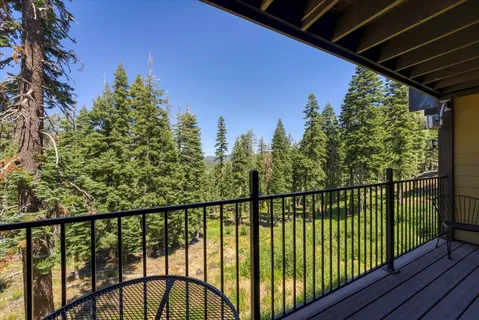 a view of a house with a yard in front of it