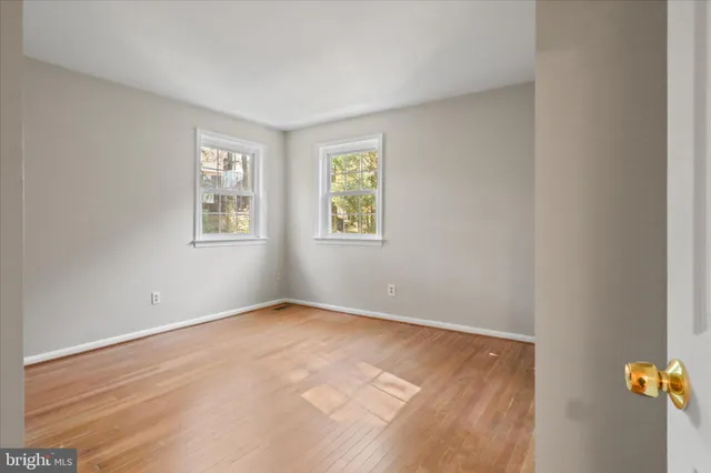 a bathroom with a shower a mirror and a sink