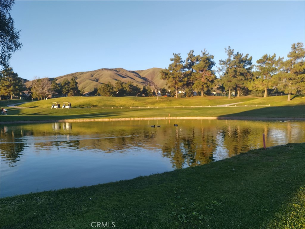 11811 Cramer Road Yucaipa, CA 92399 - Photo 54 of 56 a view of a lake with houses in the back