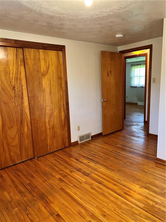 880 Pizza Barn Road Blairsville, PA 15717 - Photo 15 of 44 a view of an empty room with wooden floor and a window