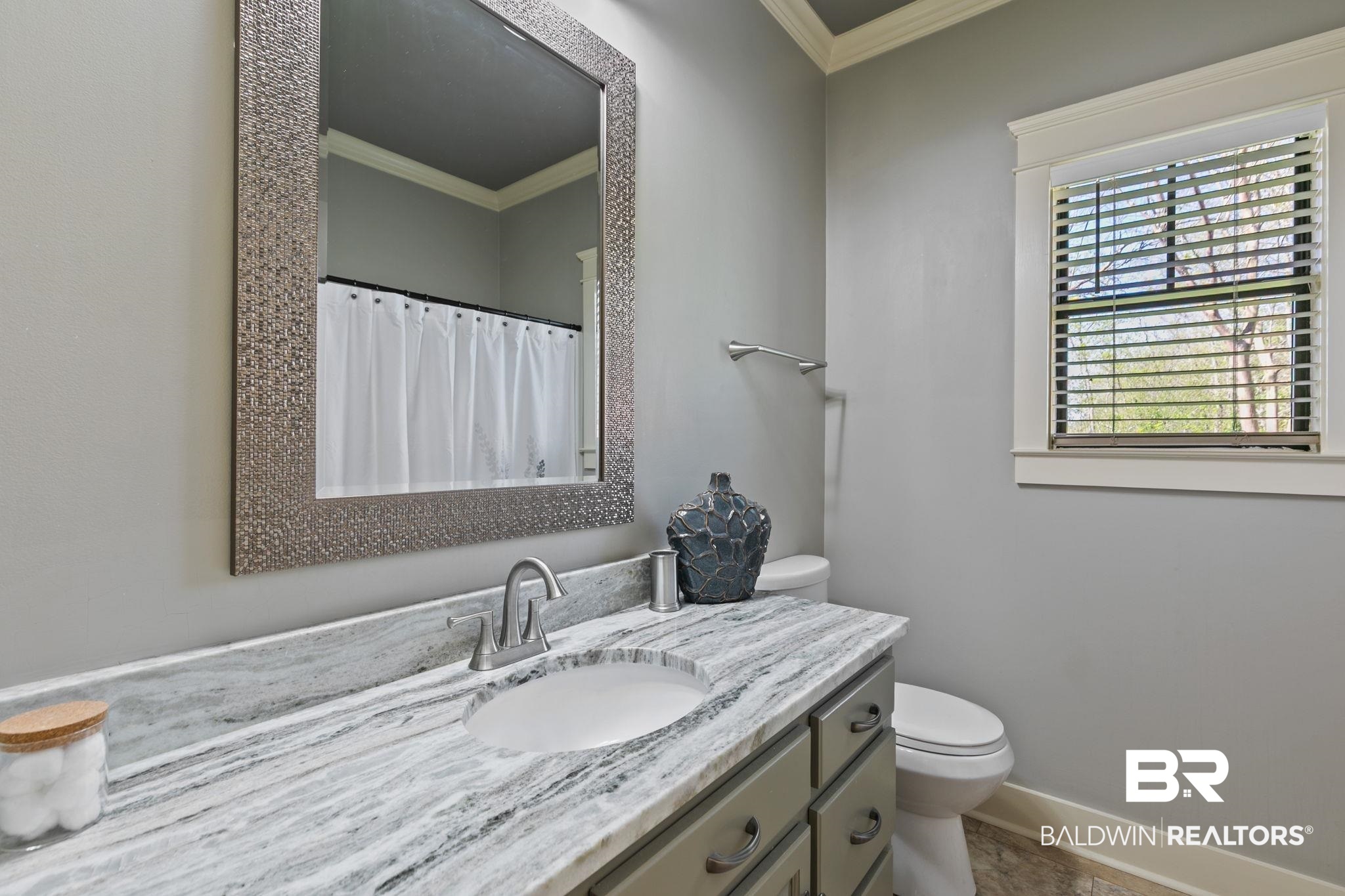 9584 Sanibel Loop Daphne, AL 36526 - Photo 31 of 48 Bathroom with vanity, ornamental molding, and a shower with curtain
