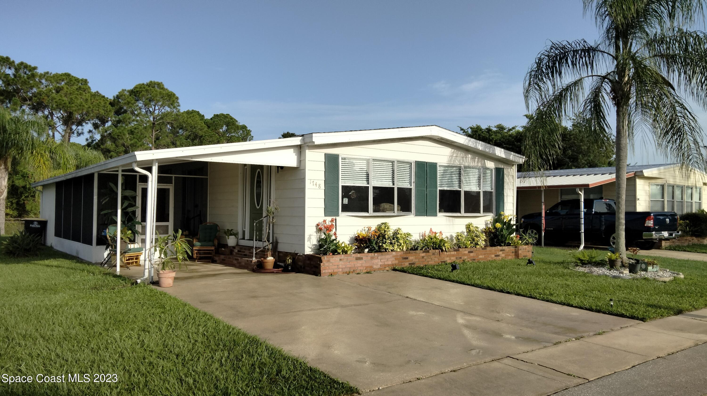 1748 Mango Street Northeast Palm Bay, FL 32905 - Photo 1 of 29 Front Quarter View
